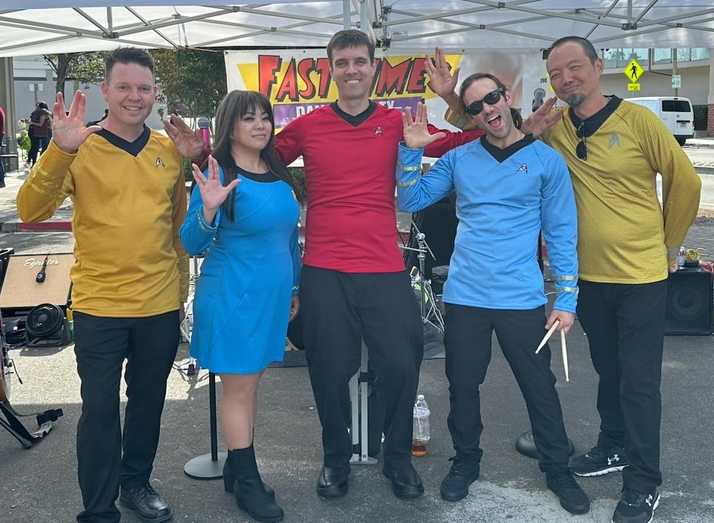 Fast Times in 1960s Star Trek Uniforms.  We can dress for your theme too.